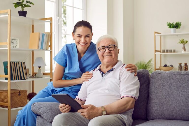 Smiling senior with a caregiver at home.