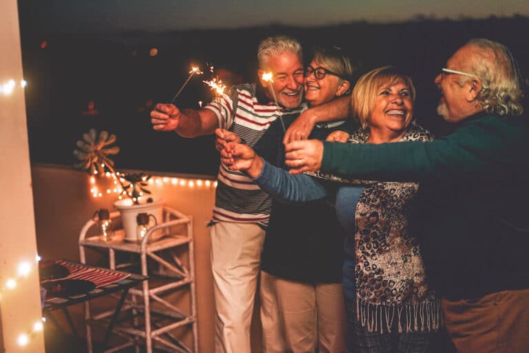 Group of seniors holding sparklers together