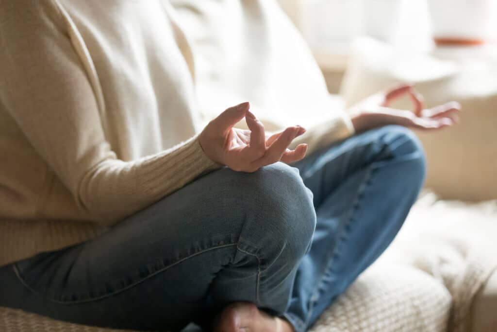 A woman meditating in a yoga pose