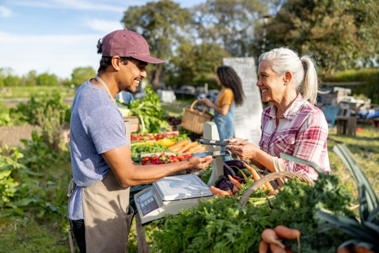 Senior buys produce at a farmers market