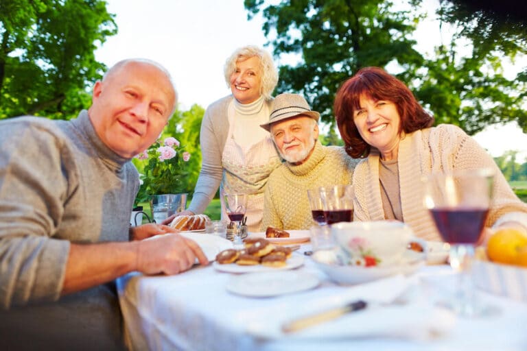 Group of seniors gathered around a table