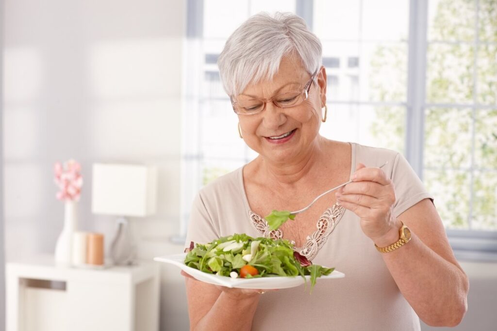 Older woman having a healthy salad for lunch