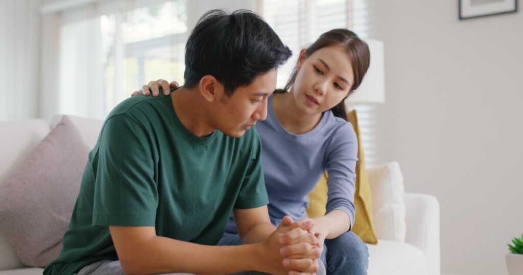 Adult woman comforting her sibling