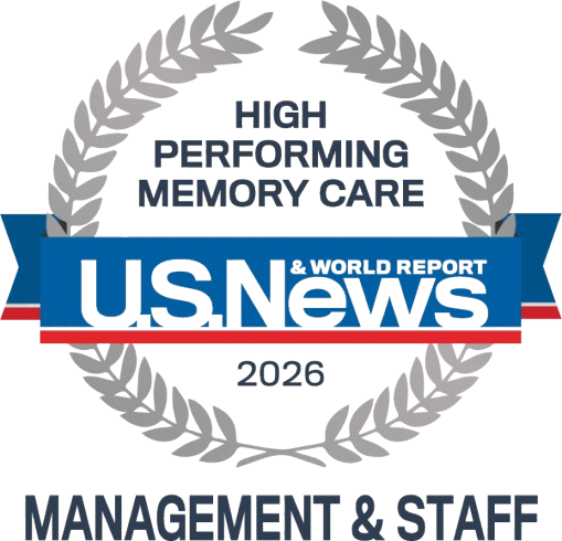 Award badge indicating US News & World Report 2026 High Performing Memory Care for Management & Staff, framed by a gray laurel wreath.