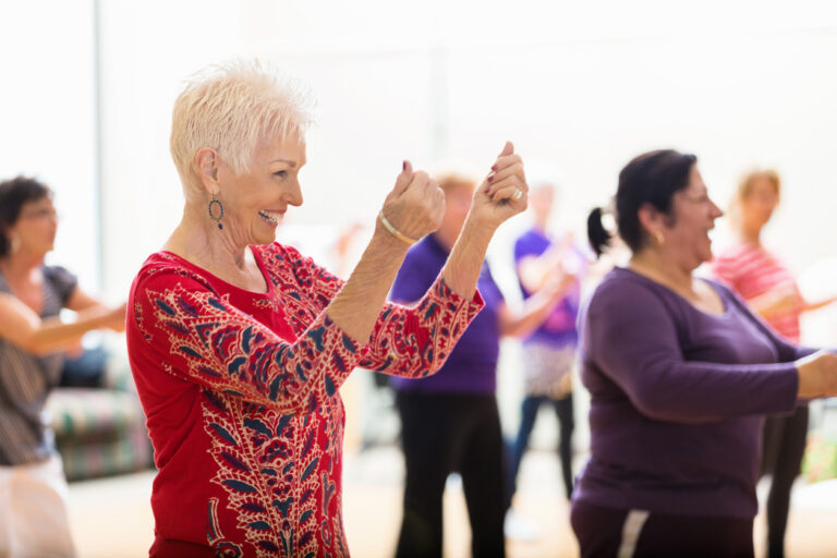 Senior woman dancing in a senior dance class